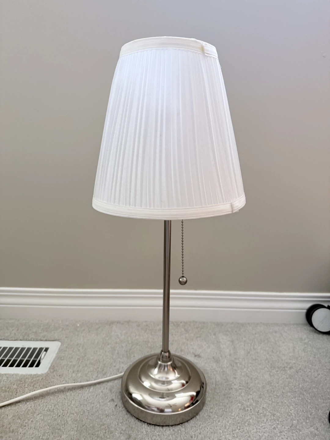 Table lamp with pleated white shade