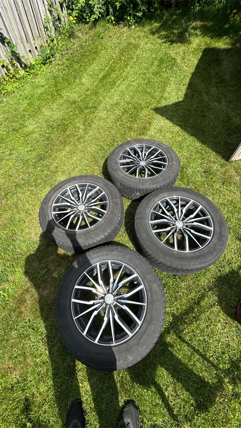Michelin X-Ice SUV 245/ 60 R18 tires on rims.