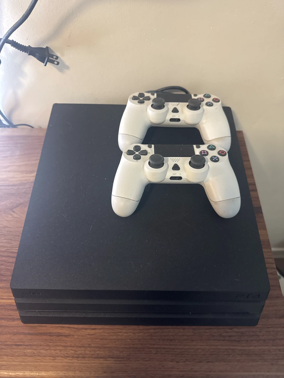 Sony PlayStation 4 Pro Console with Two Controllers