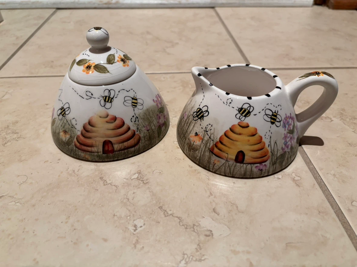 Bee-themed ceramic sugar bowl and creamer set