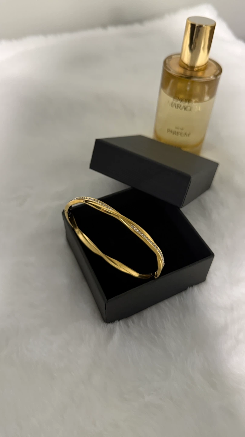 Gold-tone twisted bangle with crystals