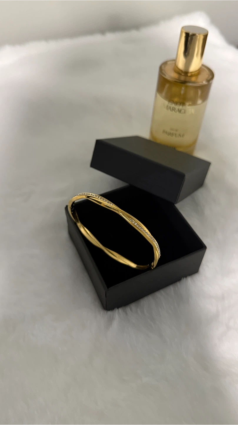 Gold-tone twisted bangle with crystals - photo 2