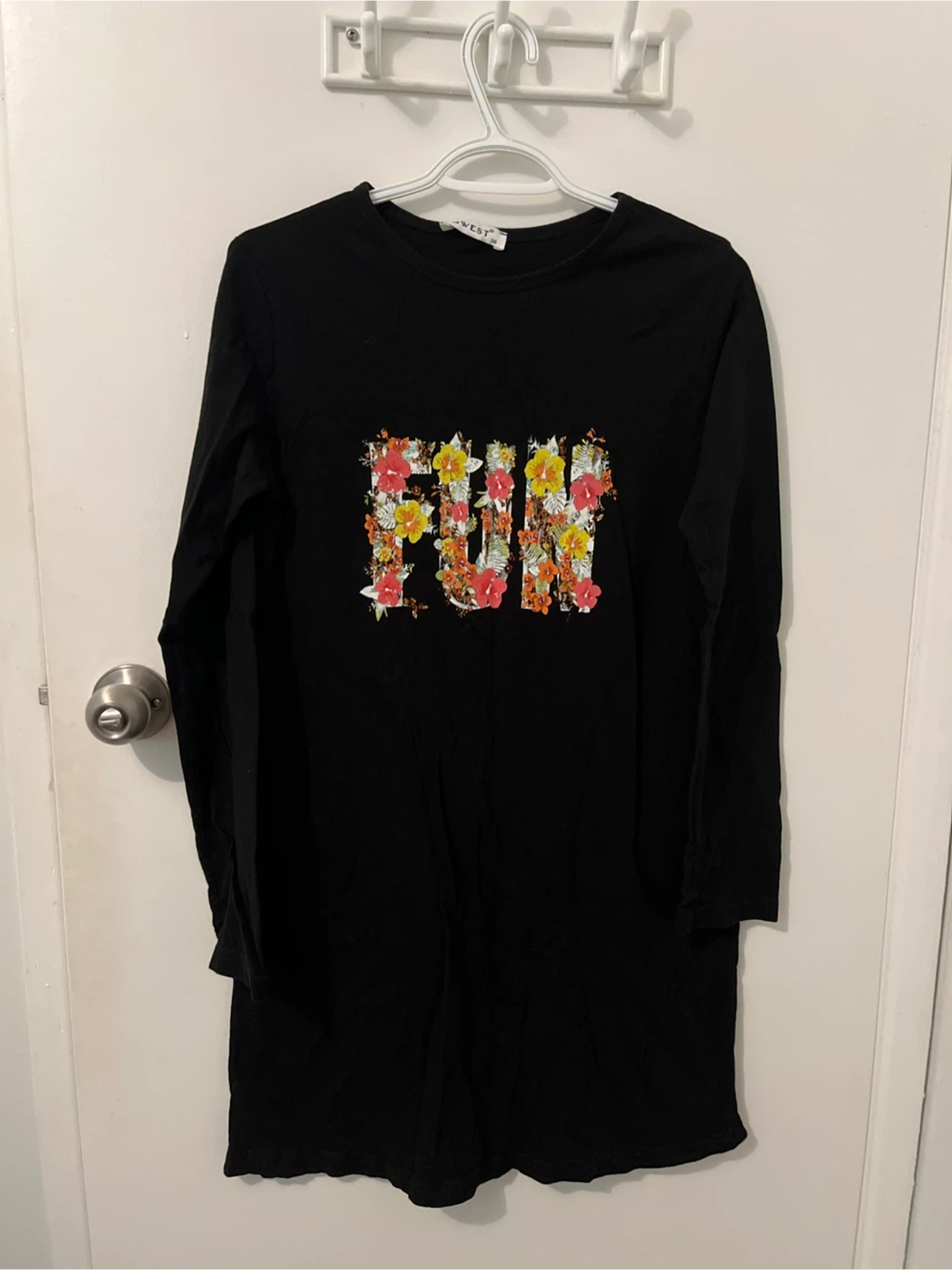 Black long sleeve shirt with floral FUN graphic