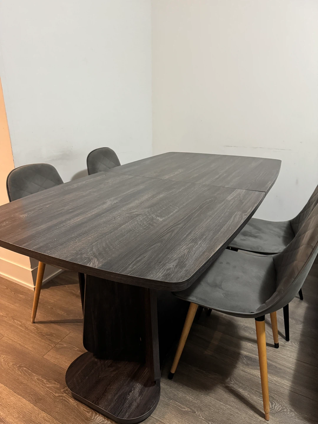 Extendable dark wood dining table with 4 chairs