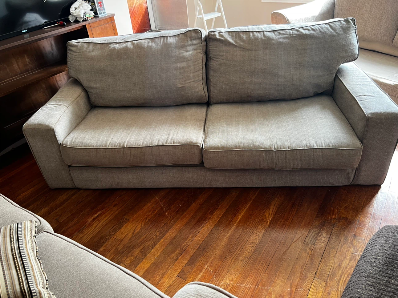 Light grey two-seater sofa