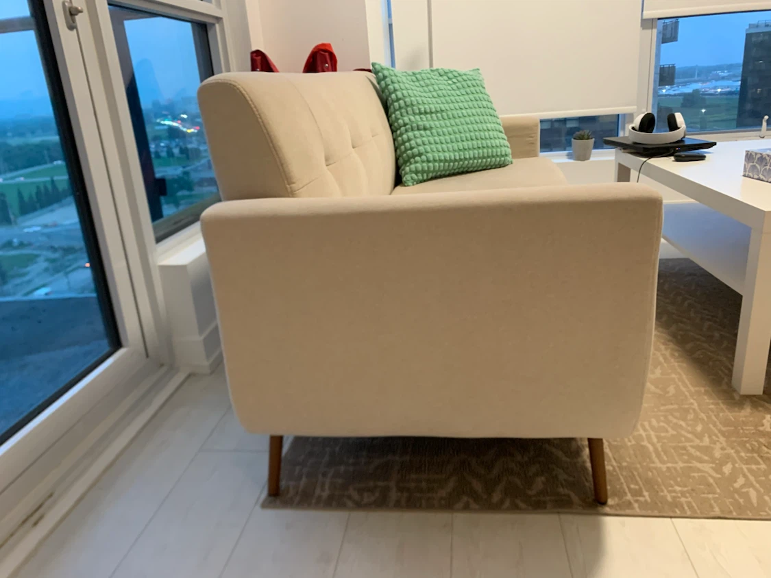 Beige Three Seater Sofa with two cushions - photo 2