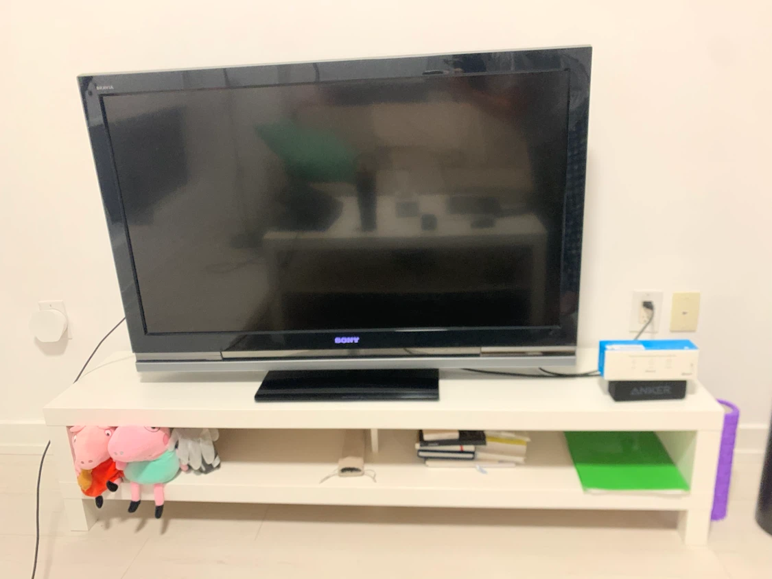 Sony Bravia TV and IKEA white media stand