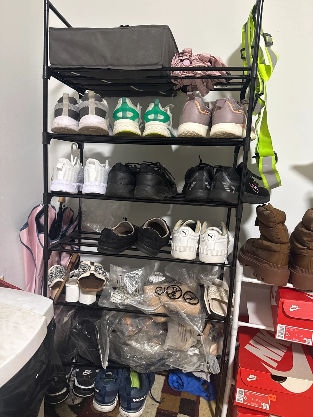 Tall black shoe storage rack