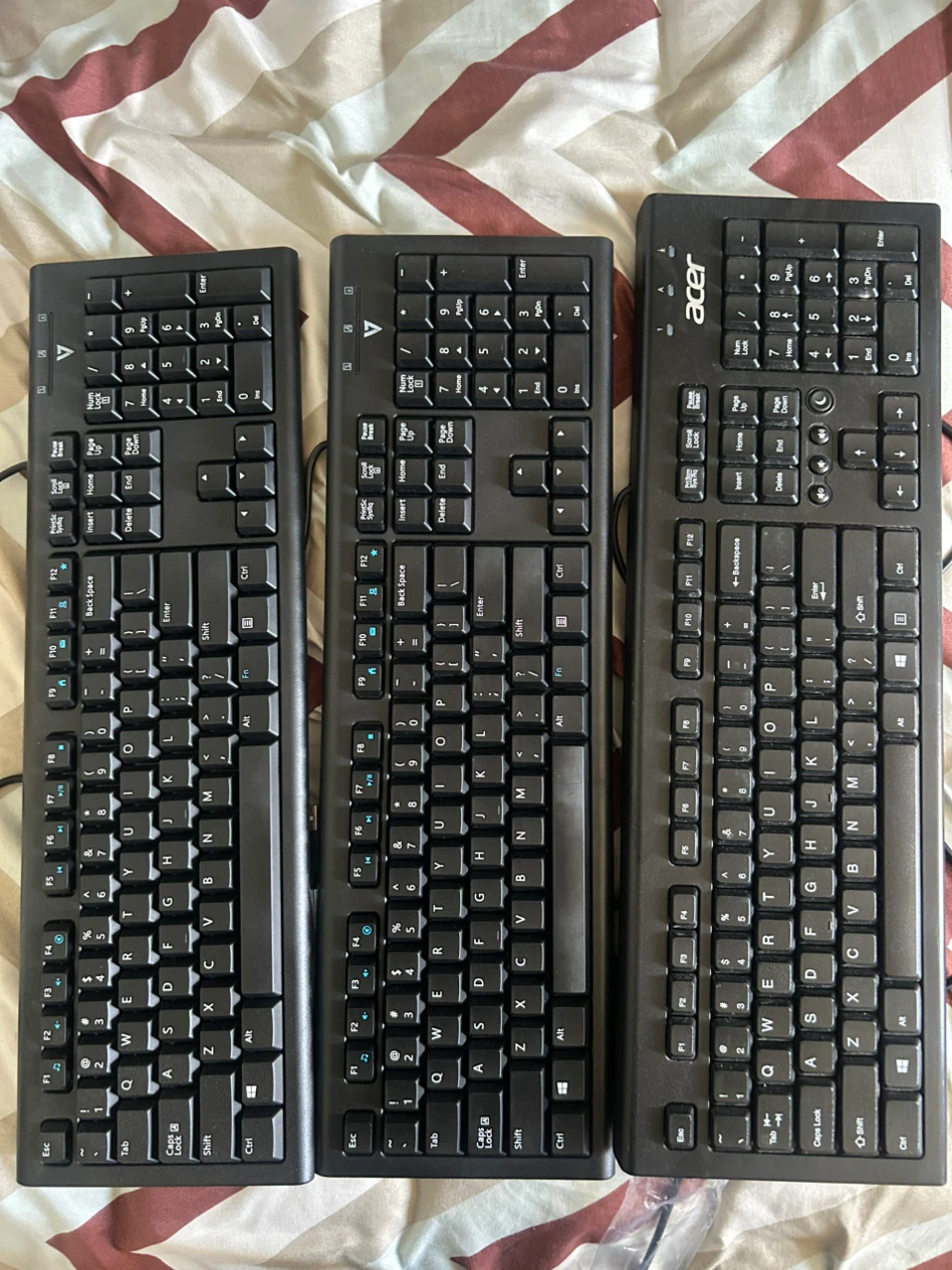 Three black keyboards