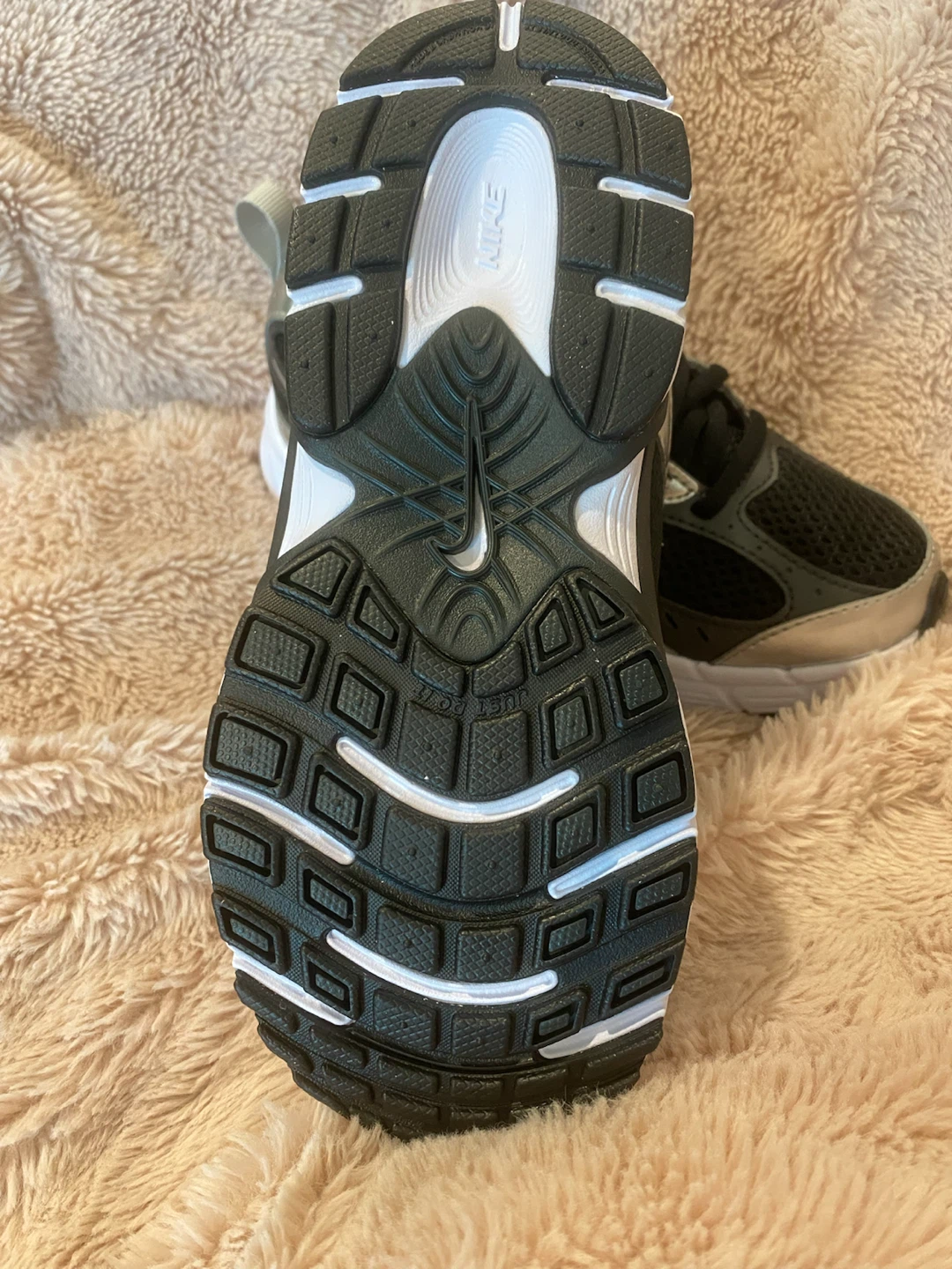 Two Pairs of Nike Kids Shoes
