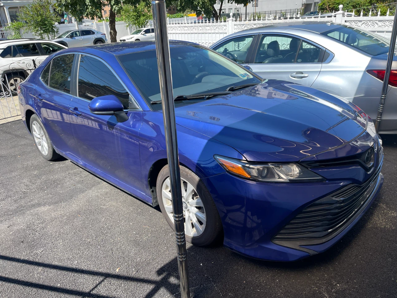 Blue Toyota Camry LE Sedan