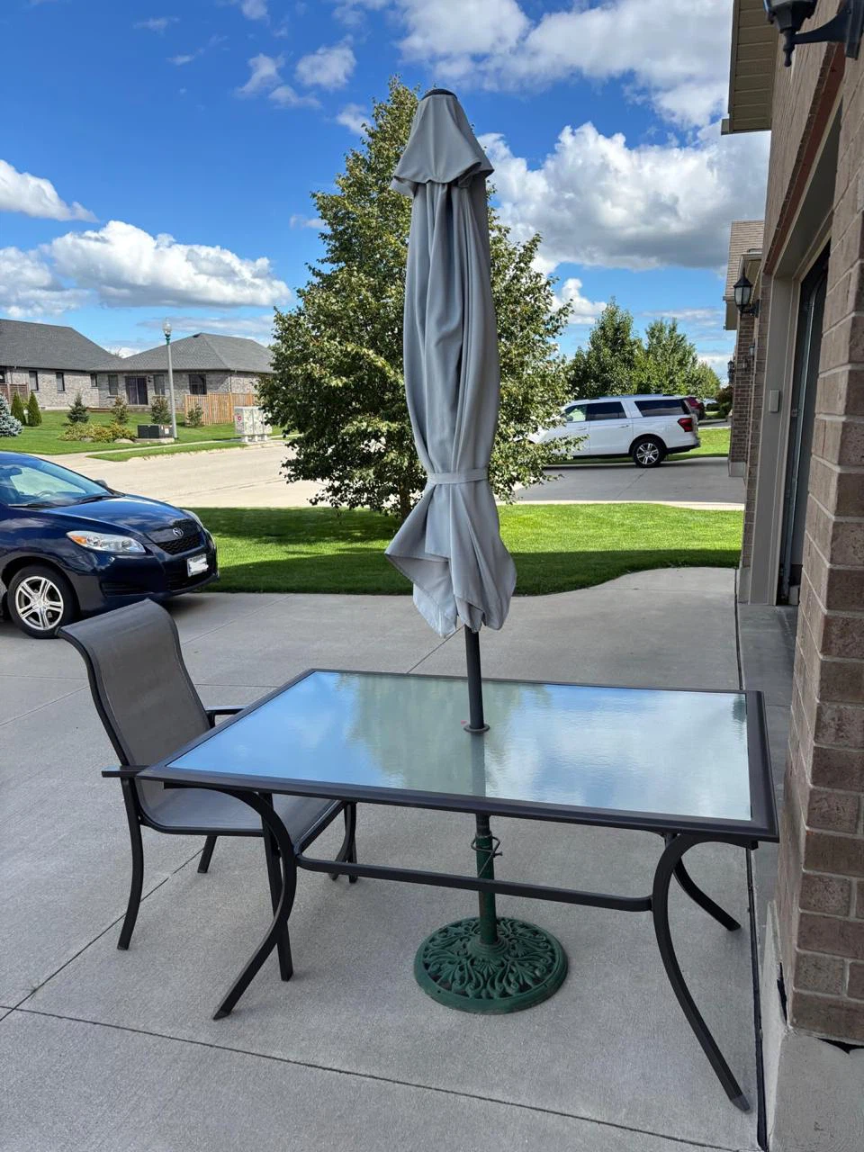 Glass Top Patio Table with Umbrella 1 chair