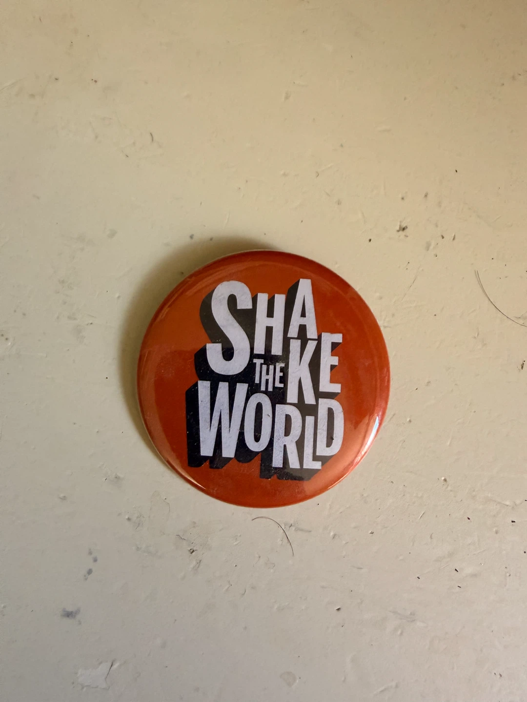 Shake the World Button