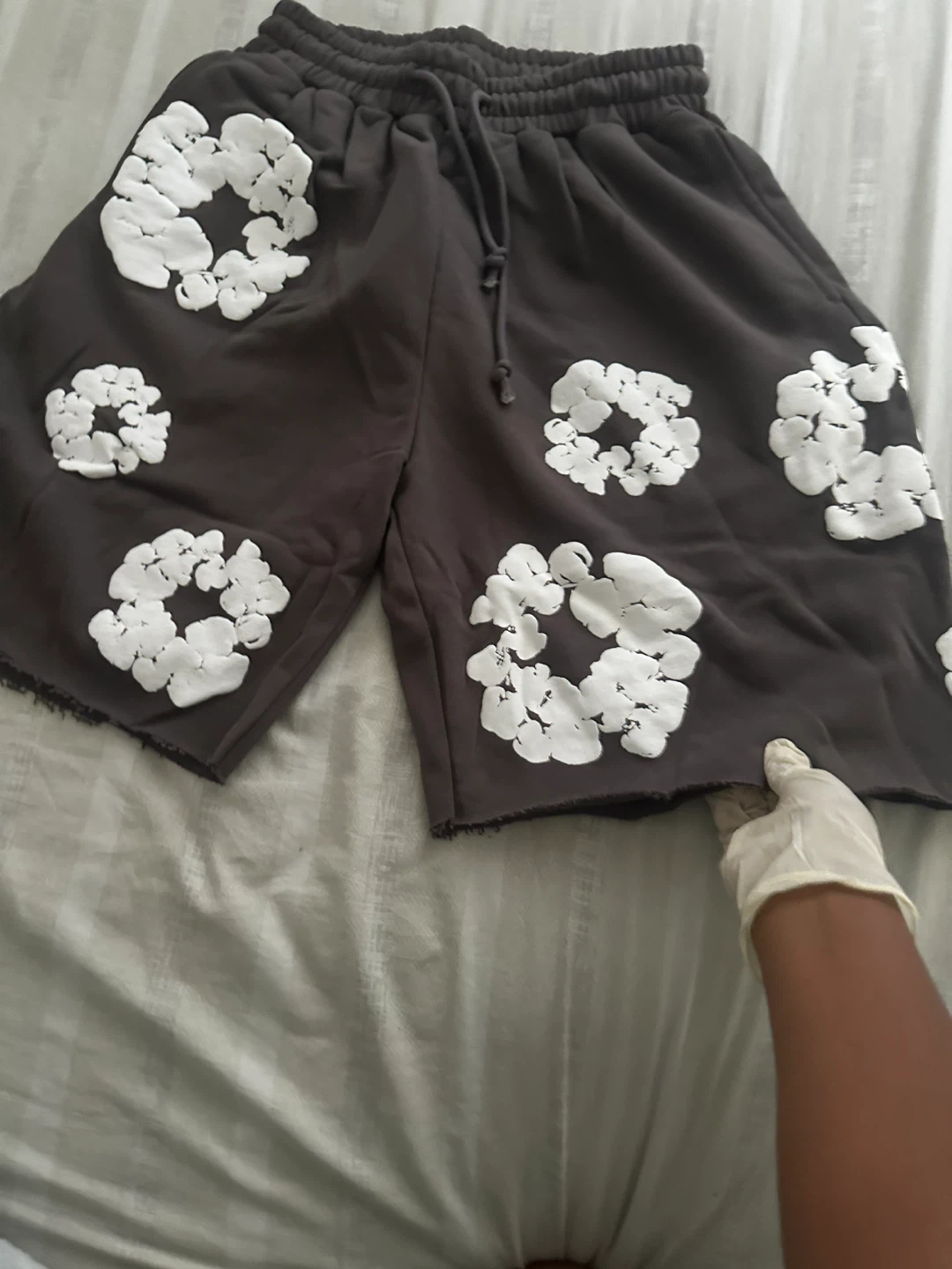 Black shorts with white floral print