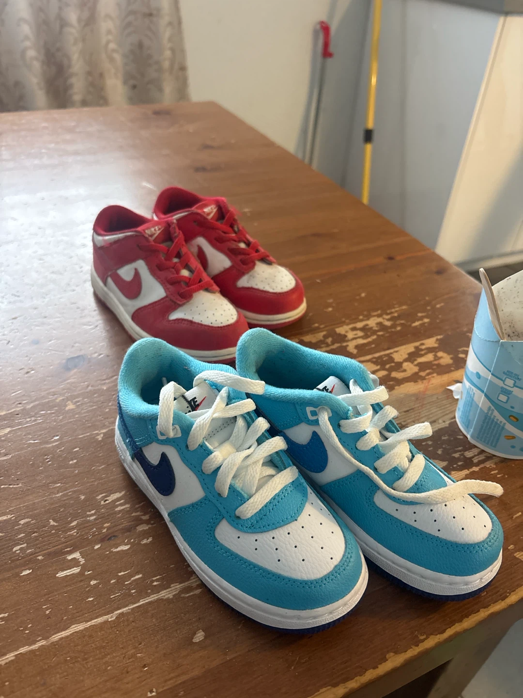 Two Pairs of Kids Nike Sneakers