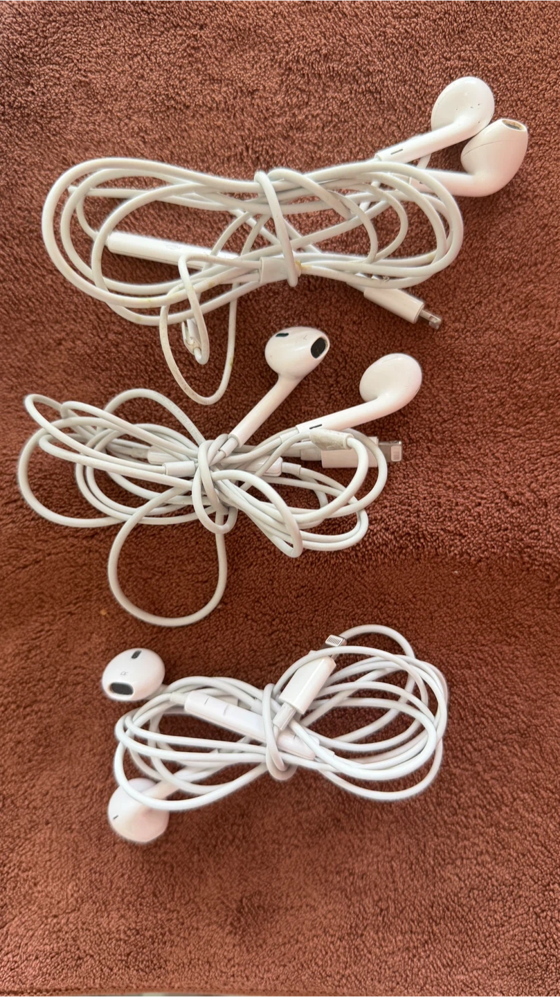 Three pairs of Apple EarPods with Lightning connector