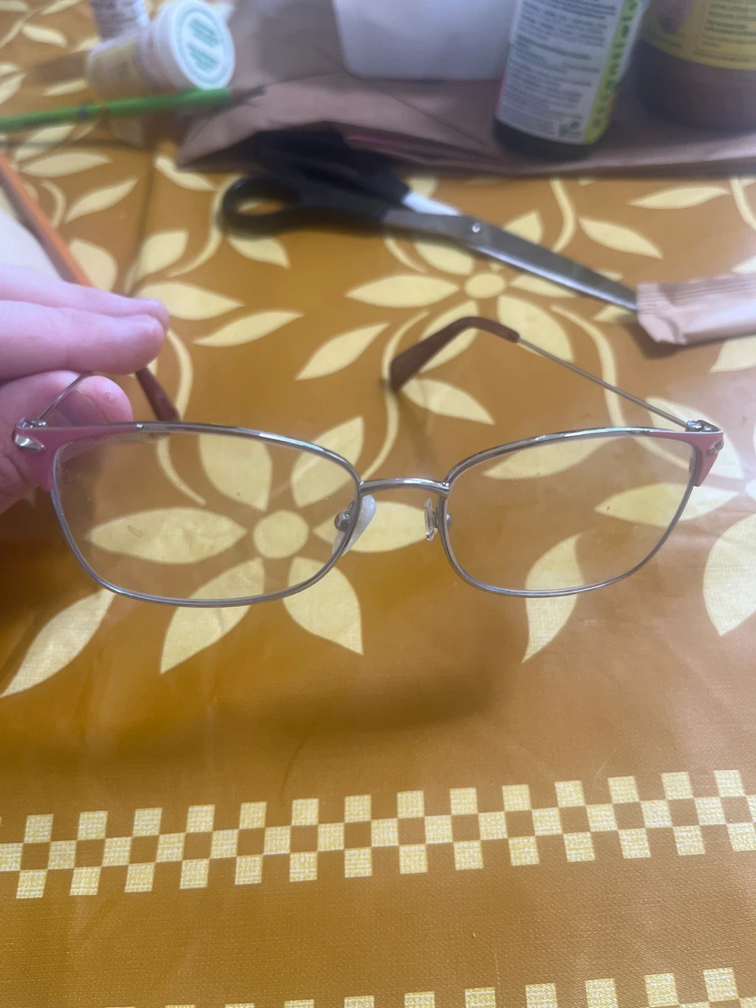 Metal frame eyeglasses with pink accents