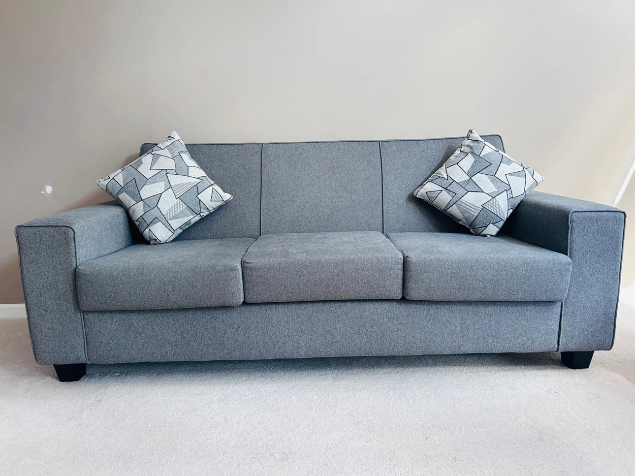 Grey Fabric Sofa with four Throw Pillows