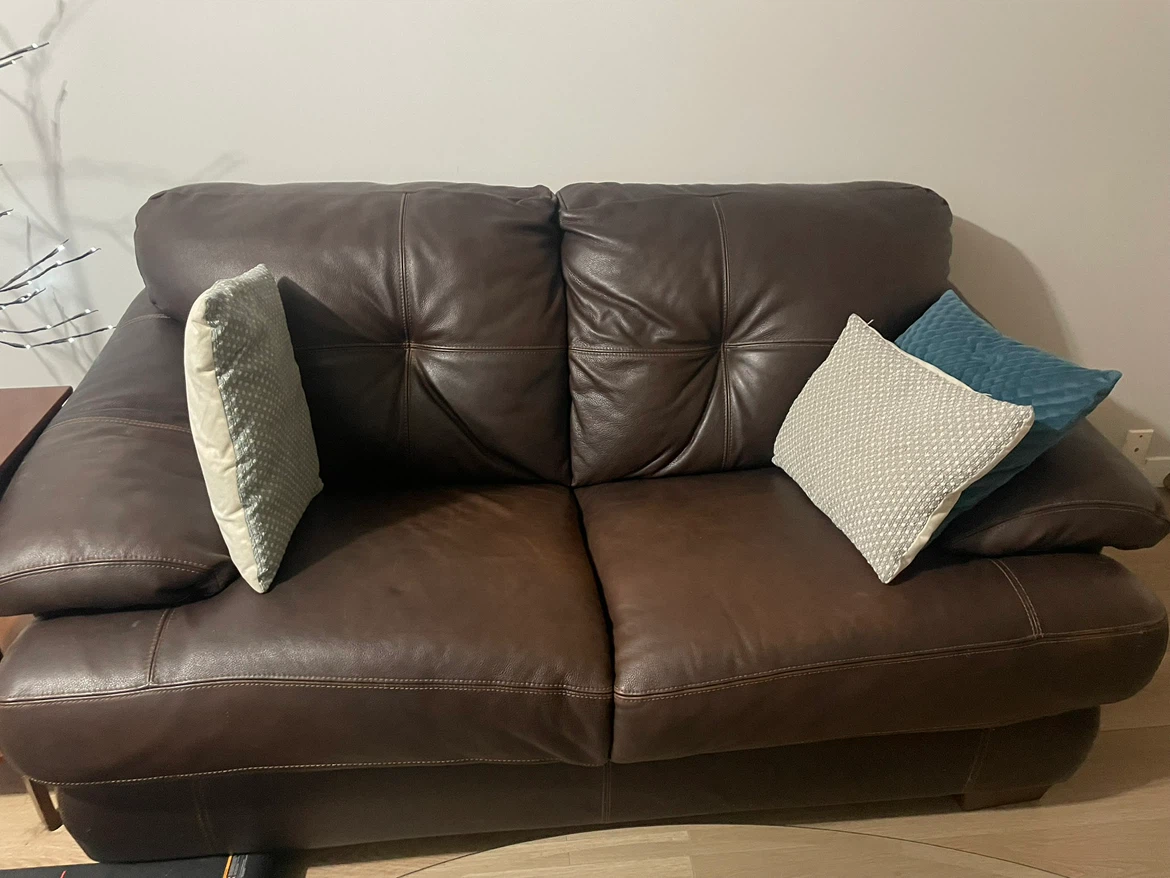 Dark brown leather loveseat