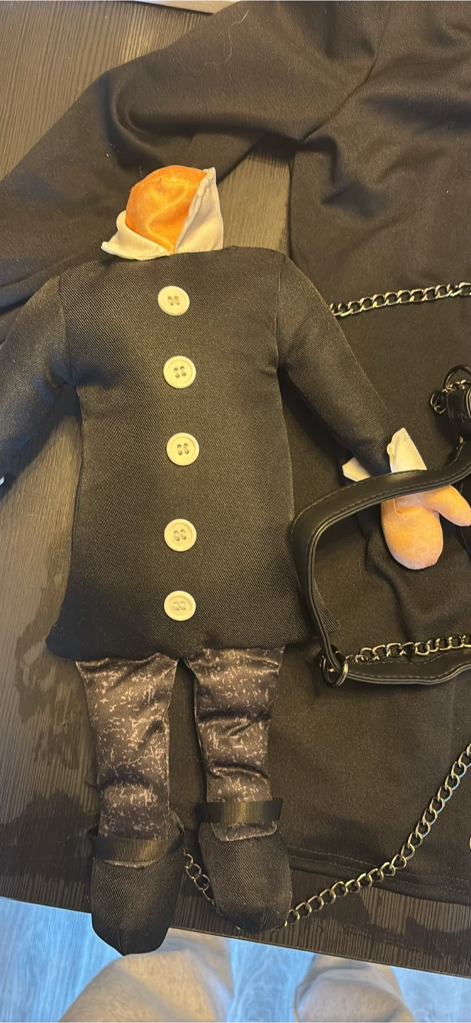 Wednesday Addams headless doll/backpack.