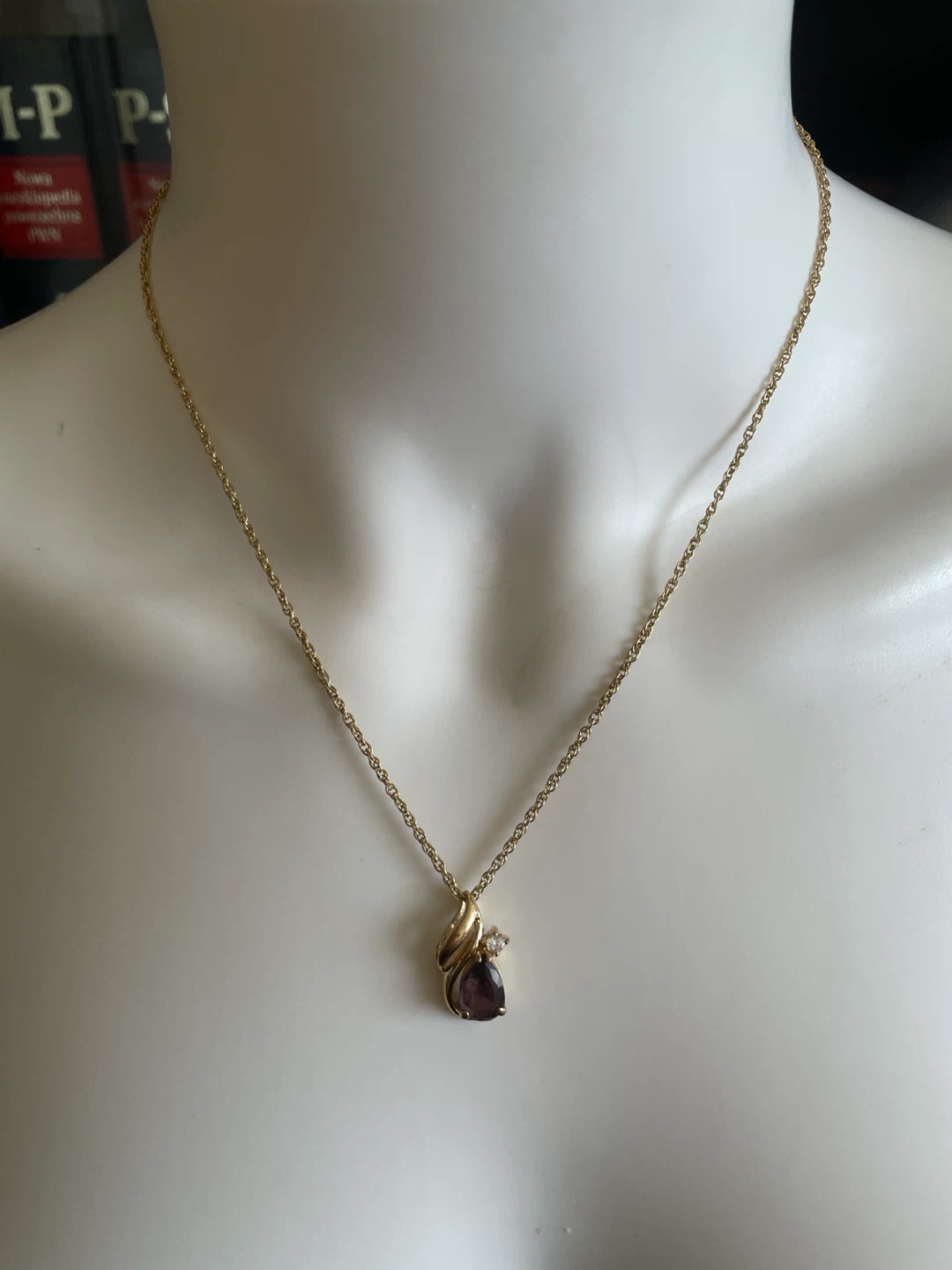 Gold-tone necklace with purple pendant