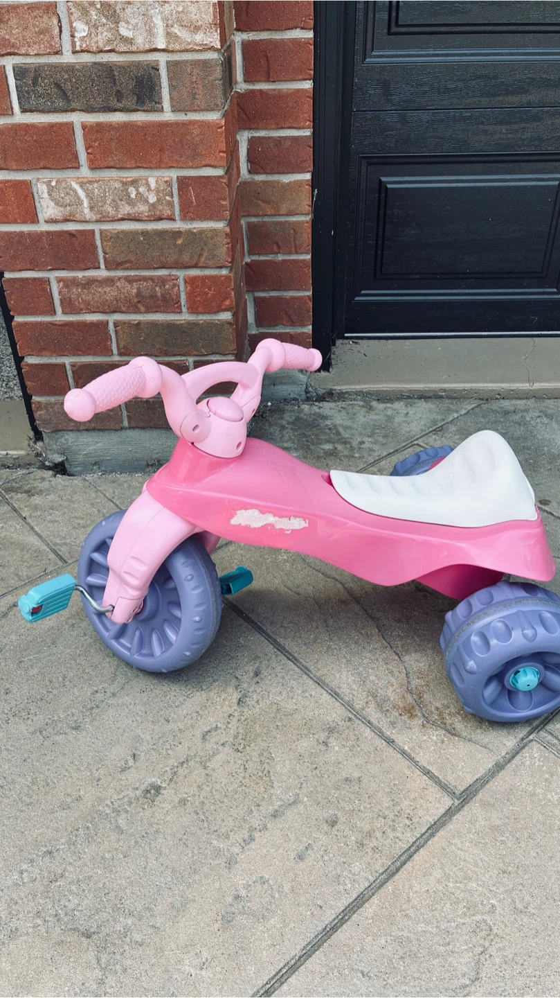 Kids ride in tricycle