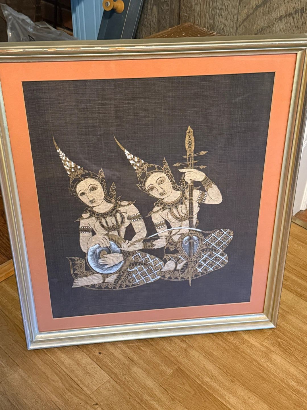 Thai musicians painting on silk.