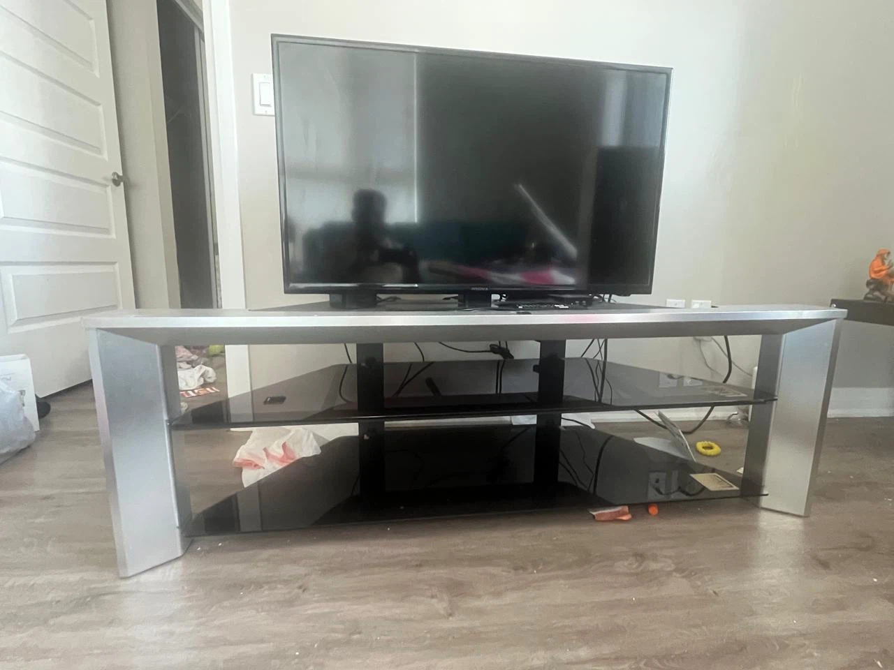 Modern Silver and Black Glass TV Stand with TV