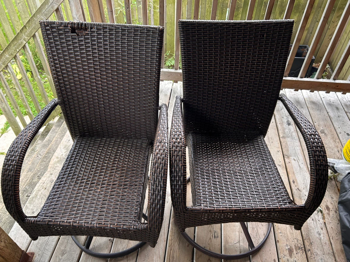 Two Brown Wicker Swivel Patio Chairs