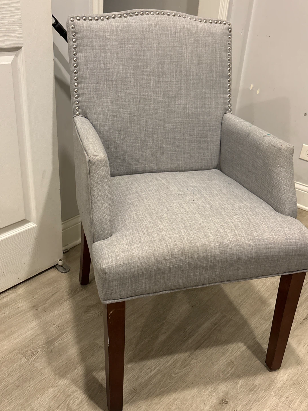 Gray Upholstered Armchair used needs cleaning