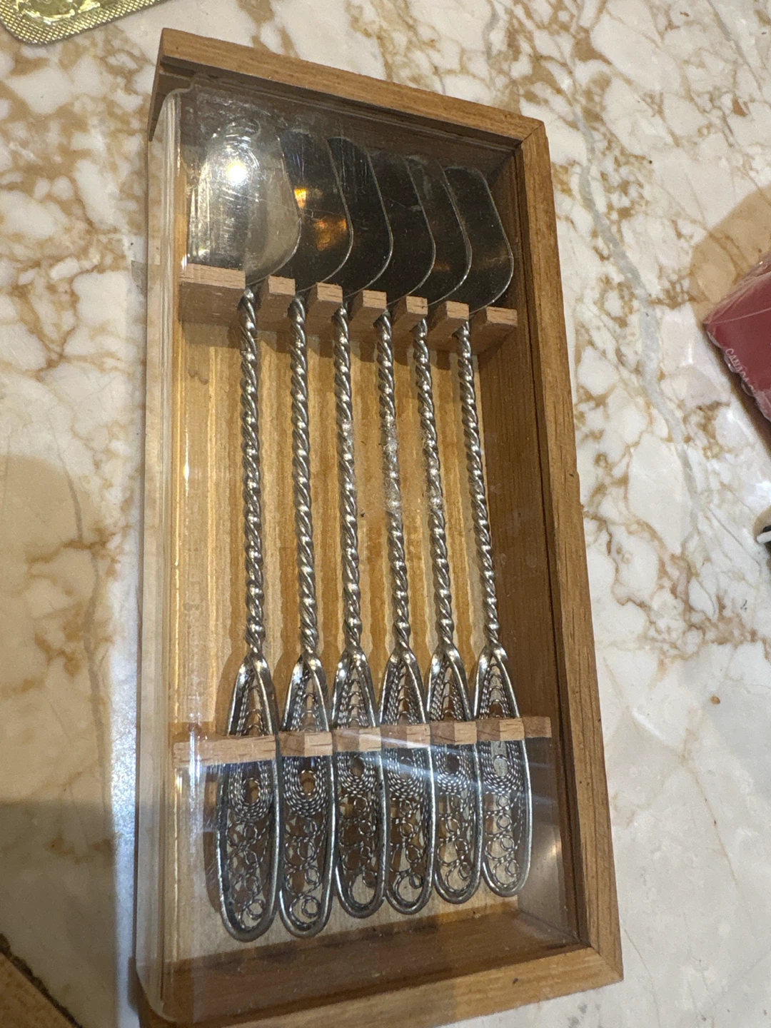 Set of 6 cased decorative silver-toned spoons