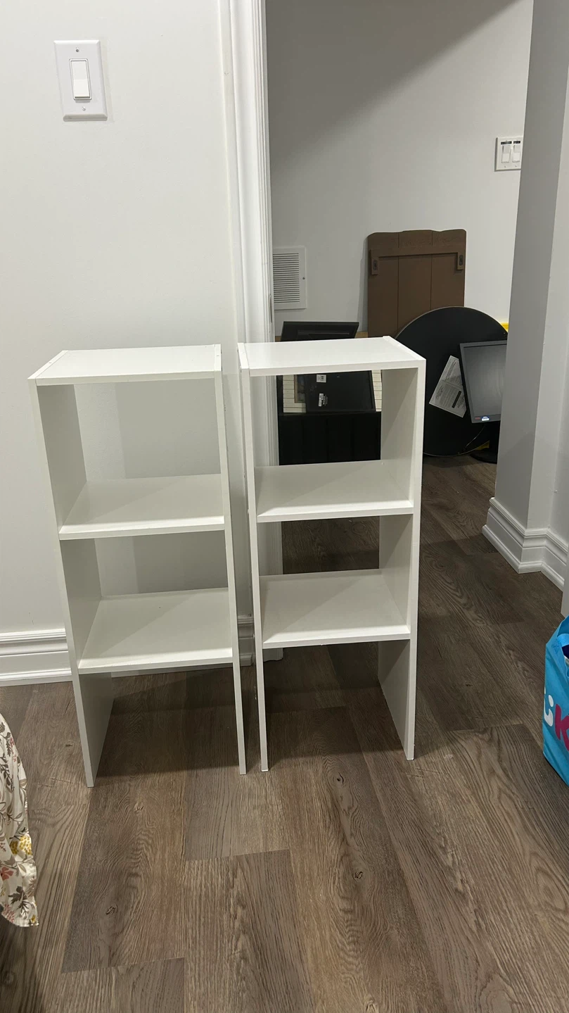 Two white bookshelf units