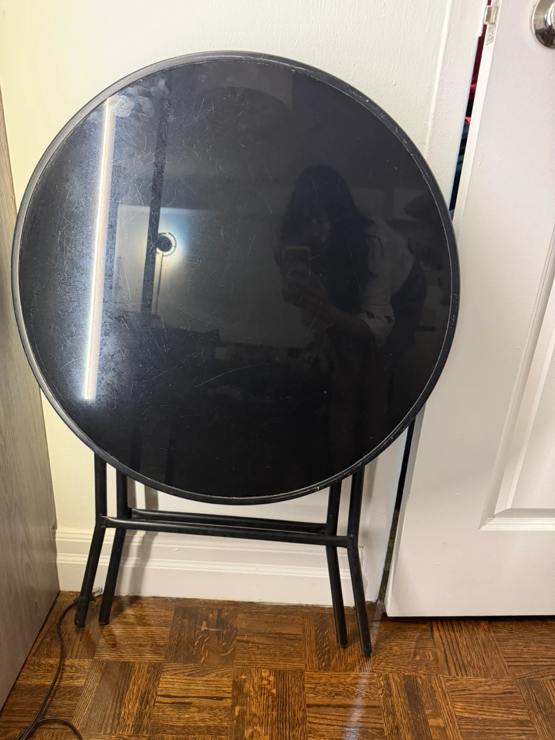 Black round folding table