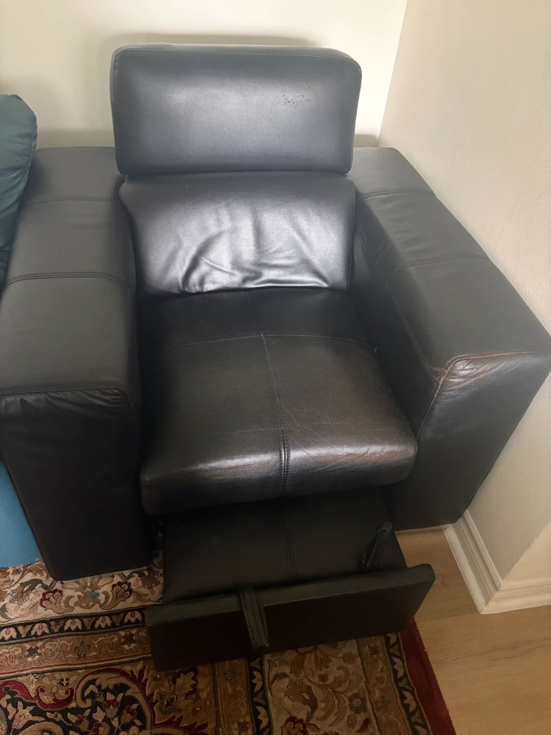 Black leather recliner armchair
