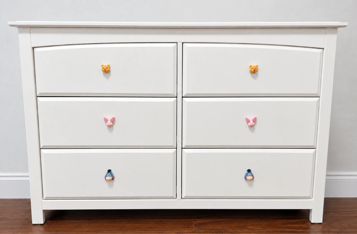 White Six-Drawer Dresser with Character Knobs
