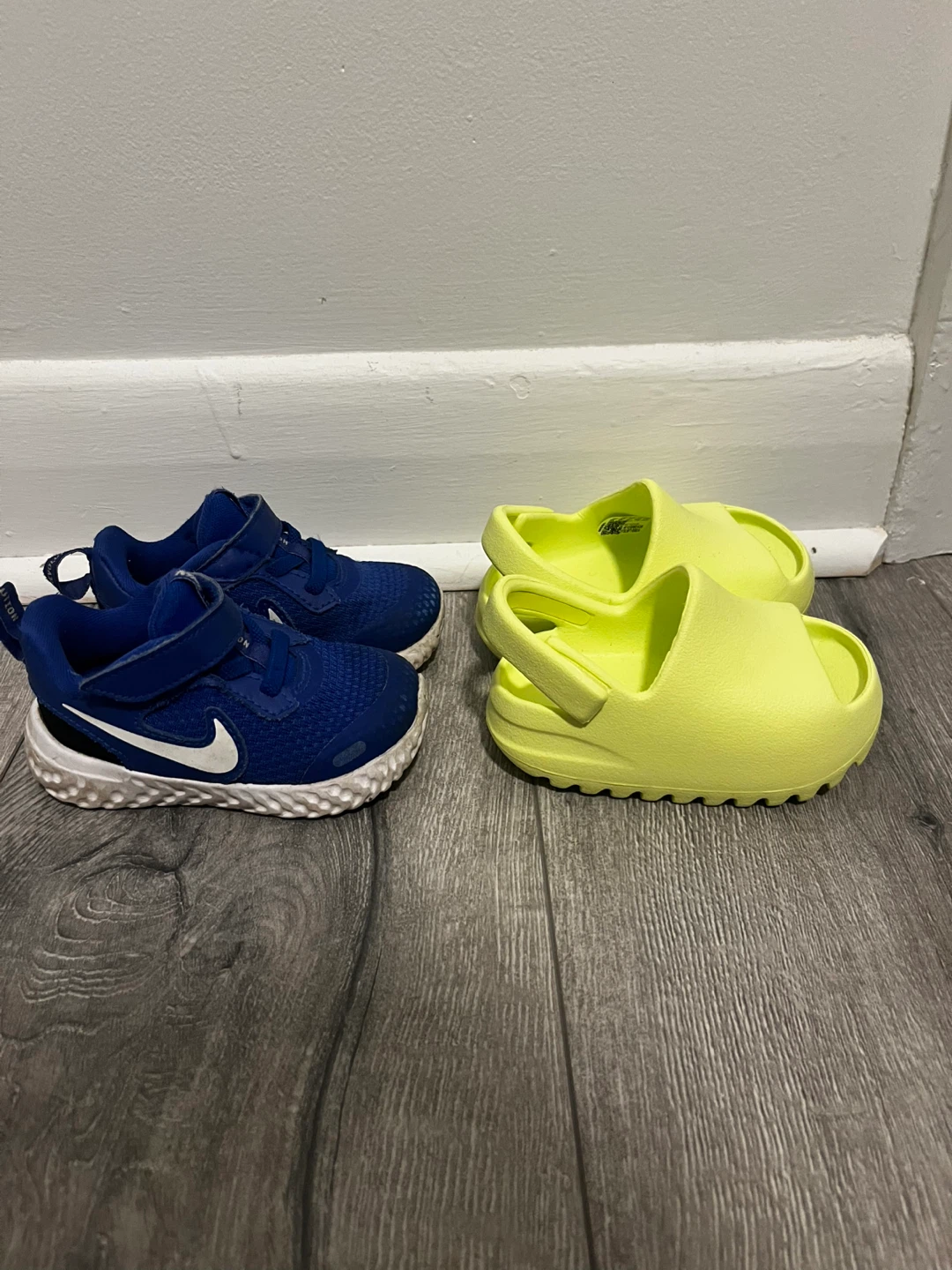 Nike sneakers and Yeezy Slides