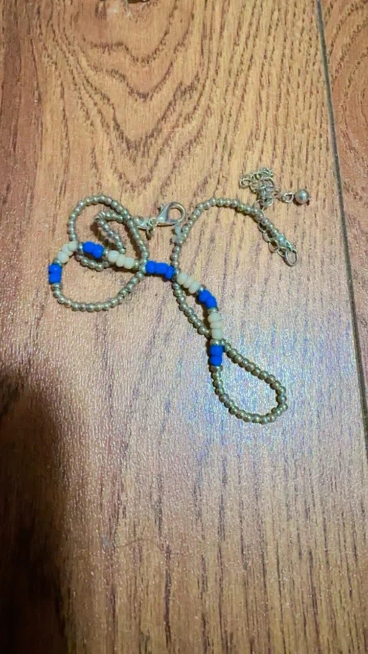 Beaded neckwear with blue and white accents