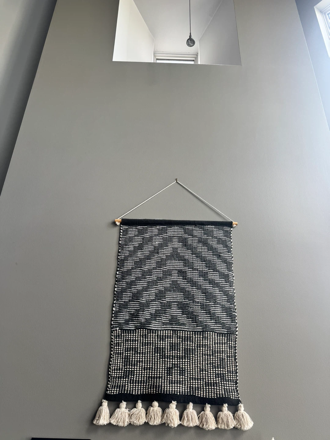 handwoven black and ivory geometric wall hanging