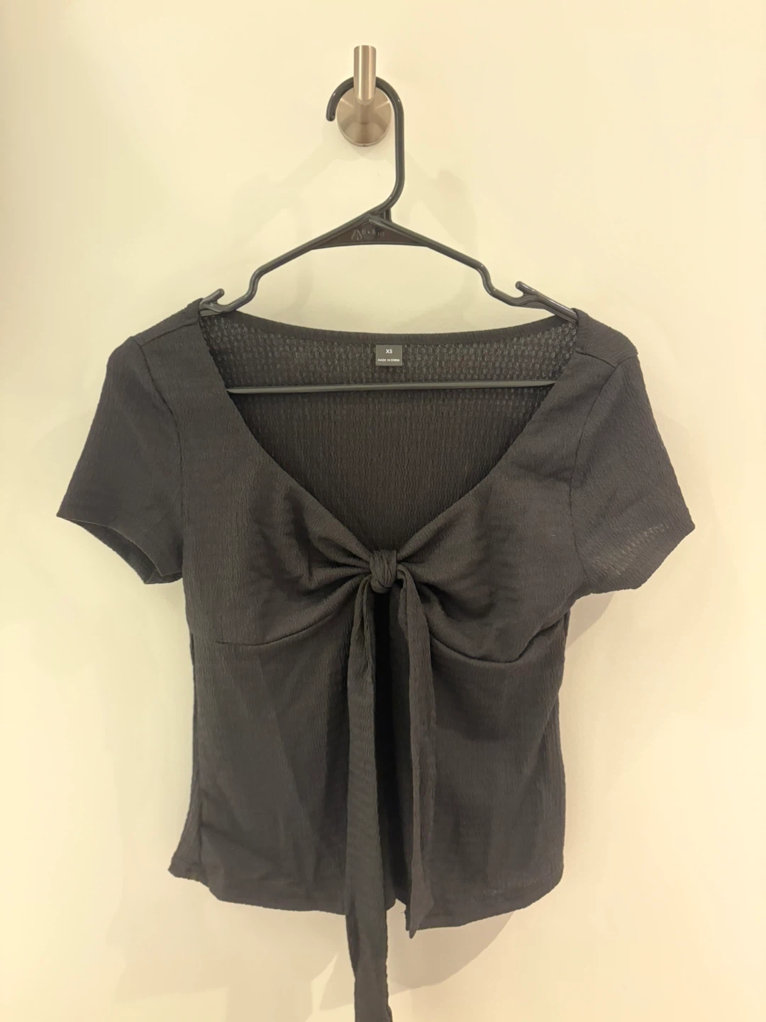 Black half open ribbon top