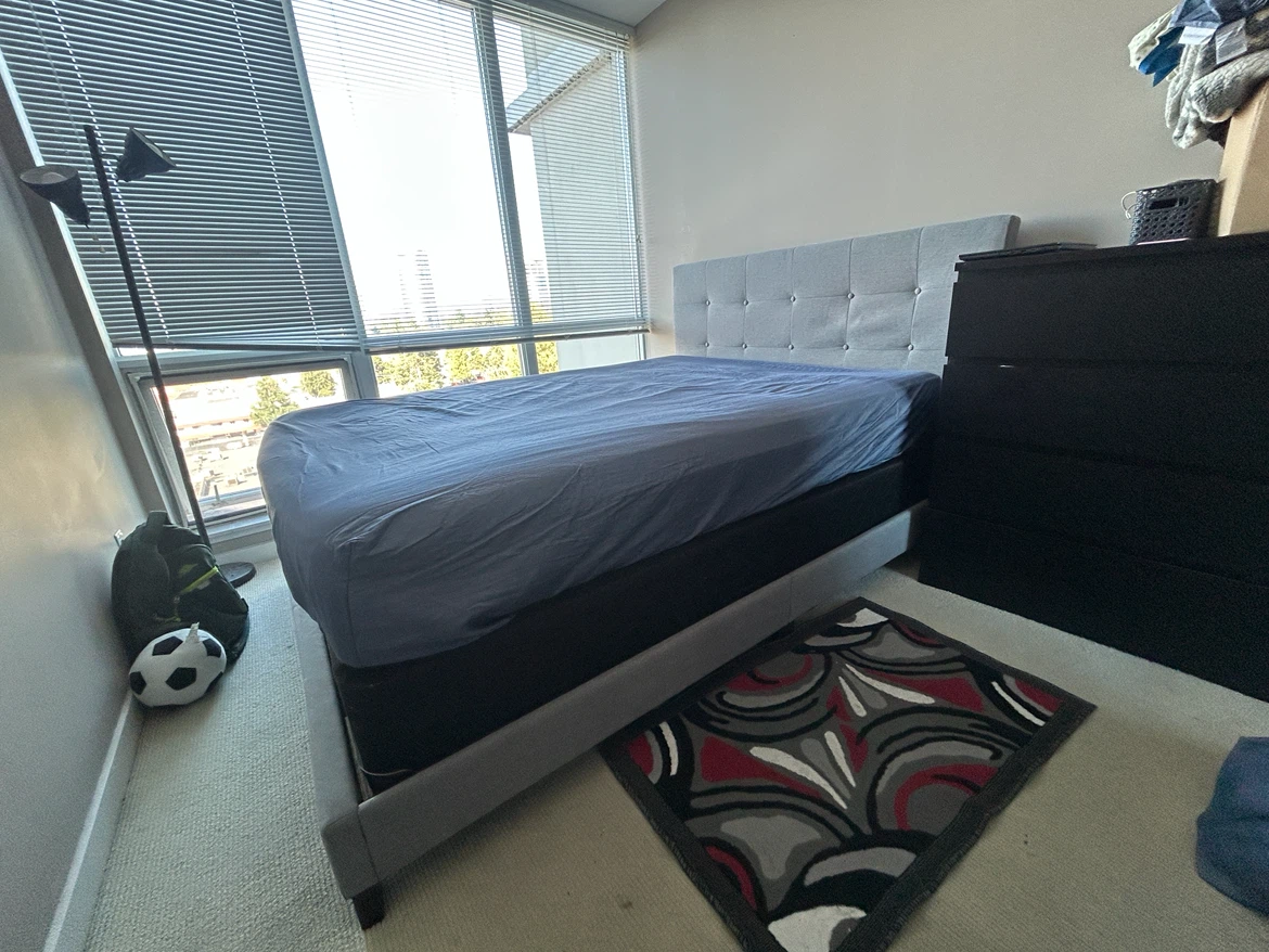 Grey Upholstered Queen Bed with Box spring.
