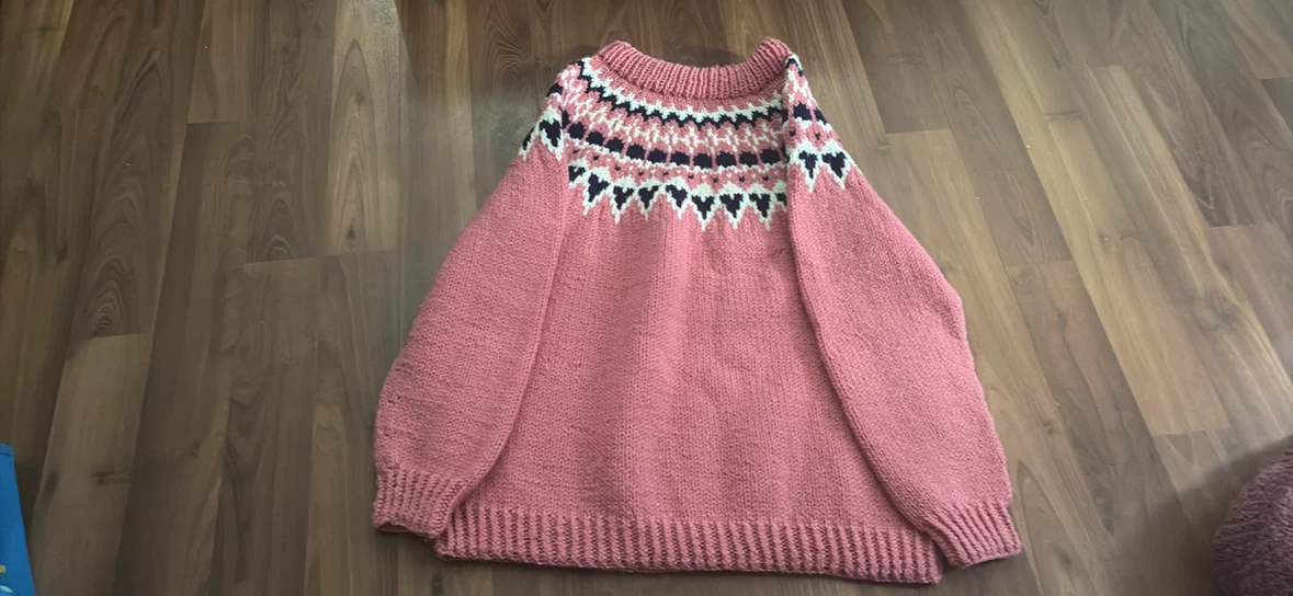 Hand-knitted pink yoke sweater