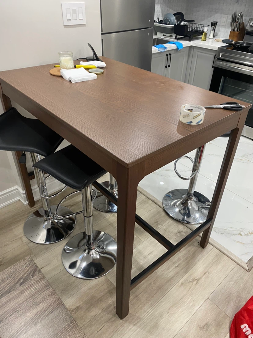 Tall brown wooden bar table.
