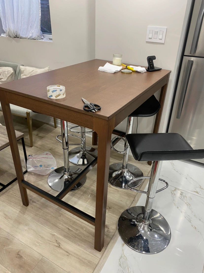 Tall brown wooden bar table. - photo 2
