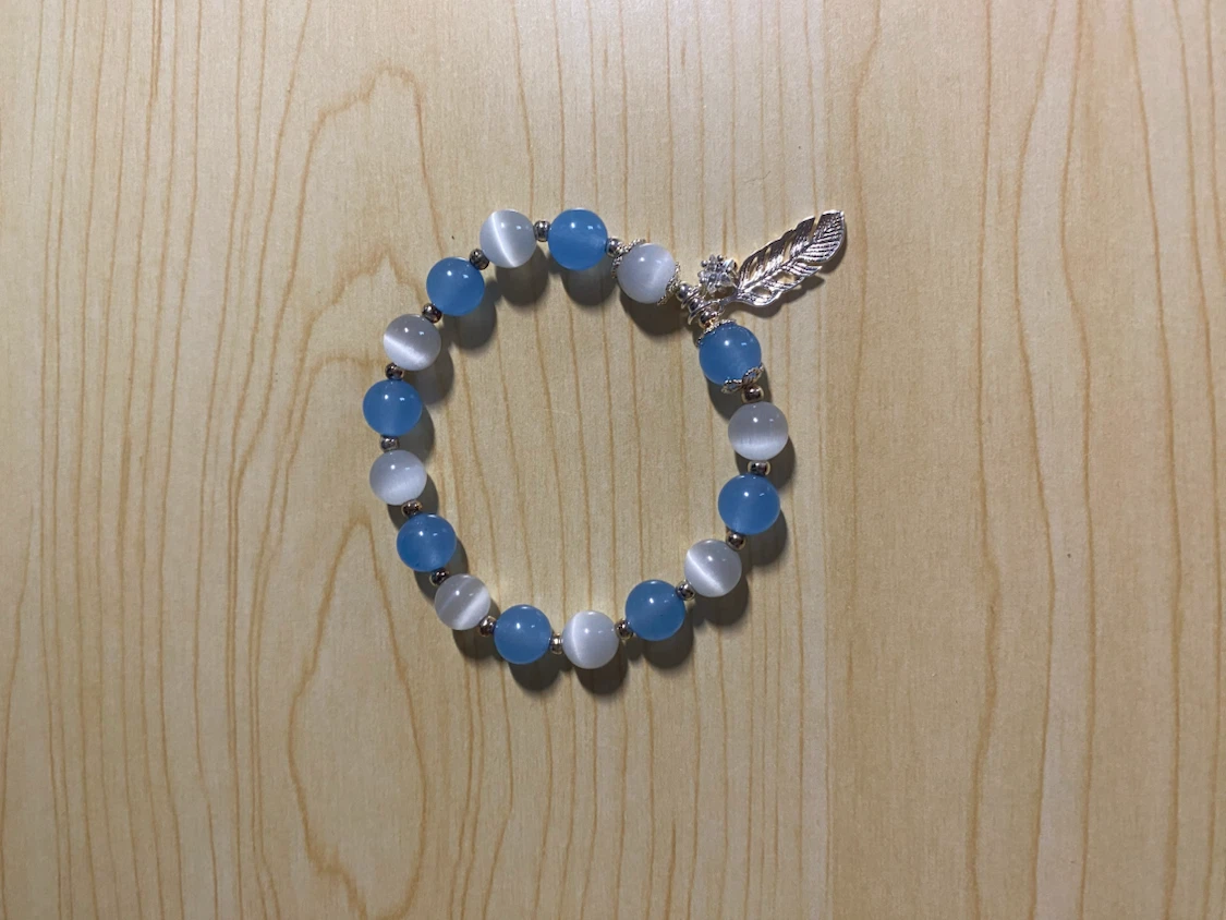 Blue and White Beaded Feather Bracelet