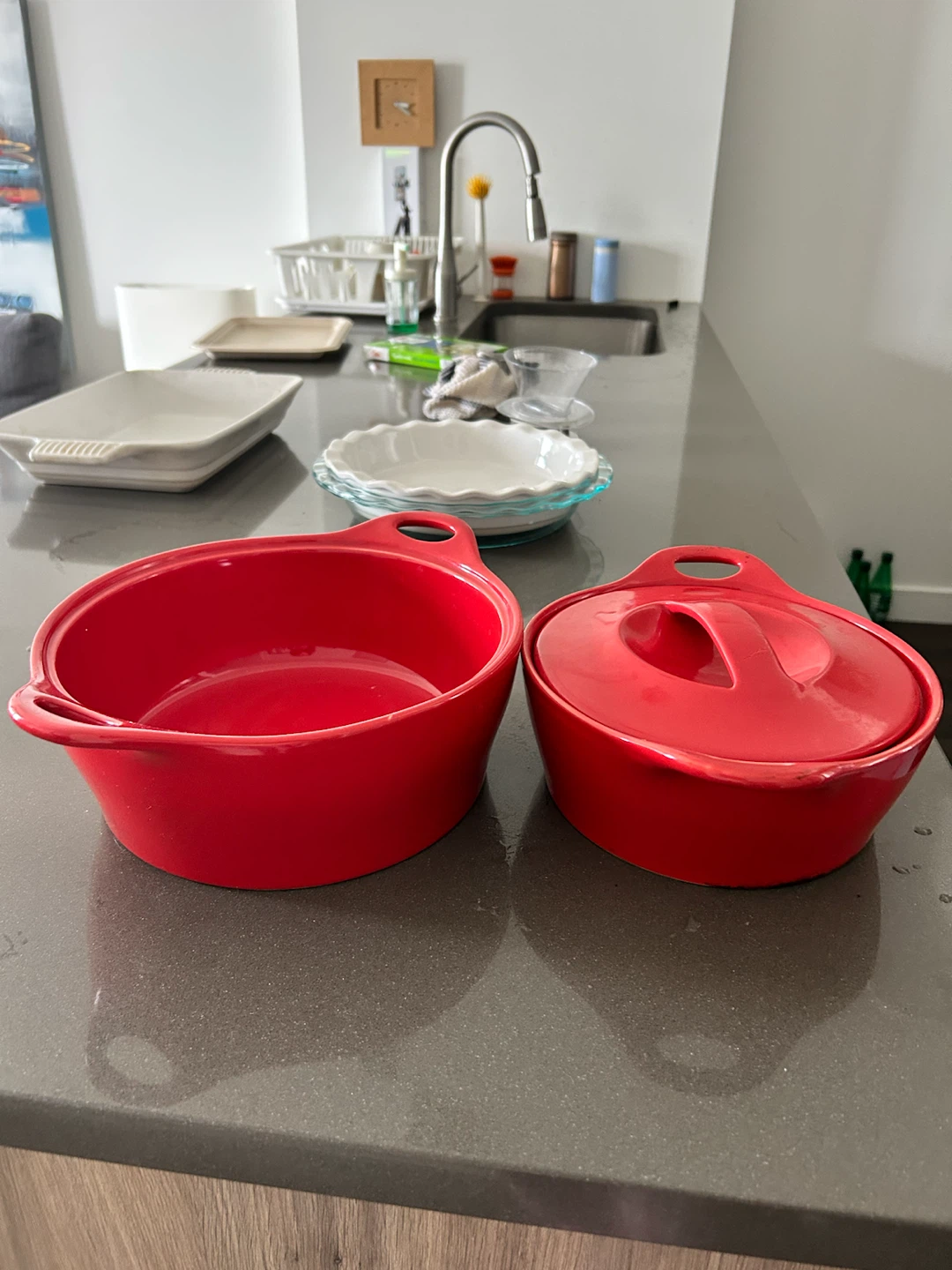 Set of two red ceramic lidded pots