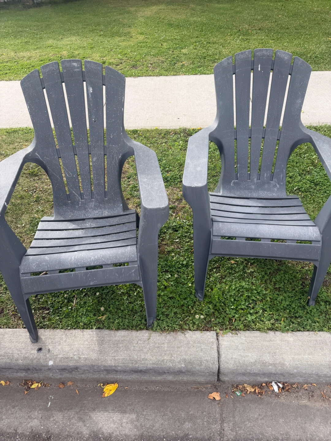 Two Grey Resin Muskoka Chairs
