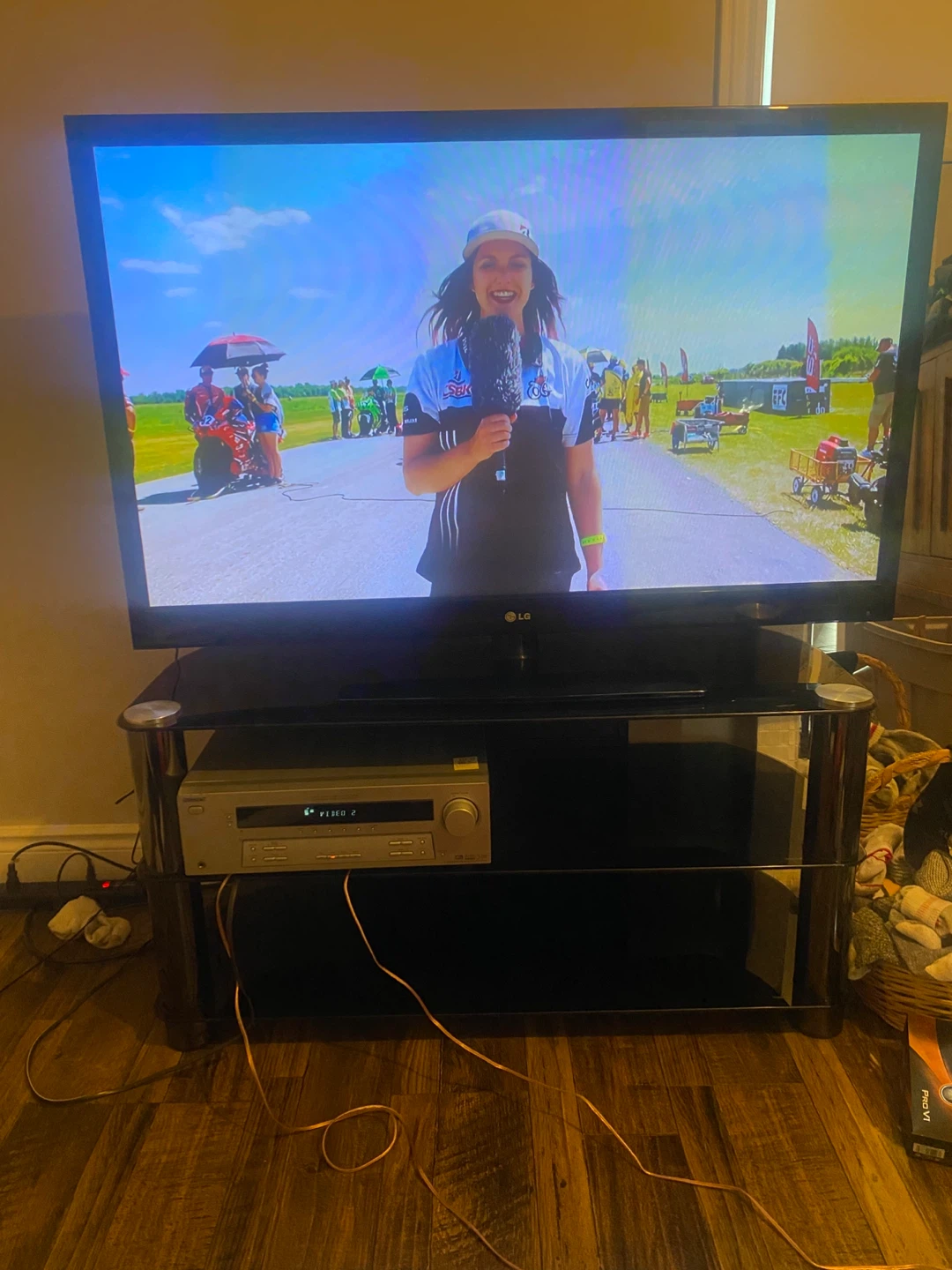 LG Television with Black Glass TV Stand