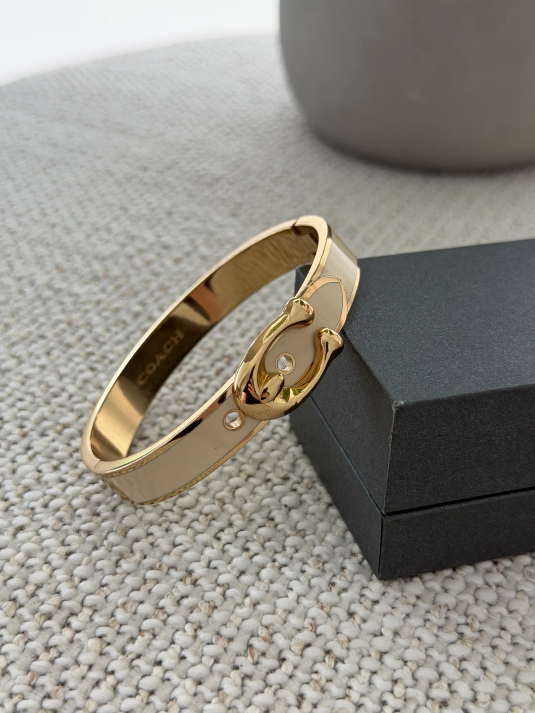 Coach gold-tone and enamel hinge bangle