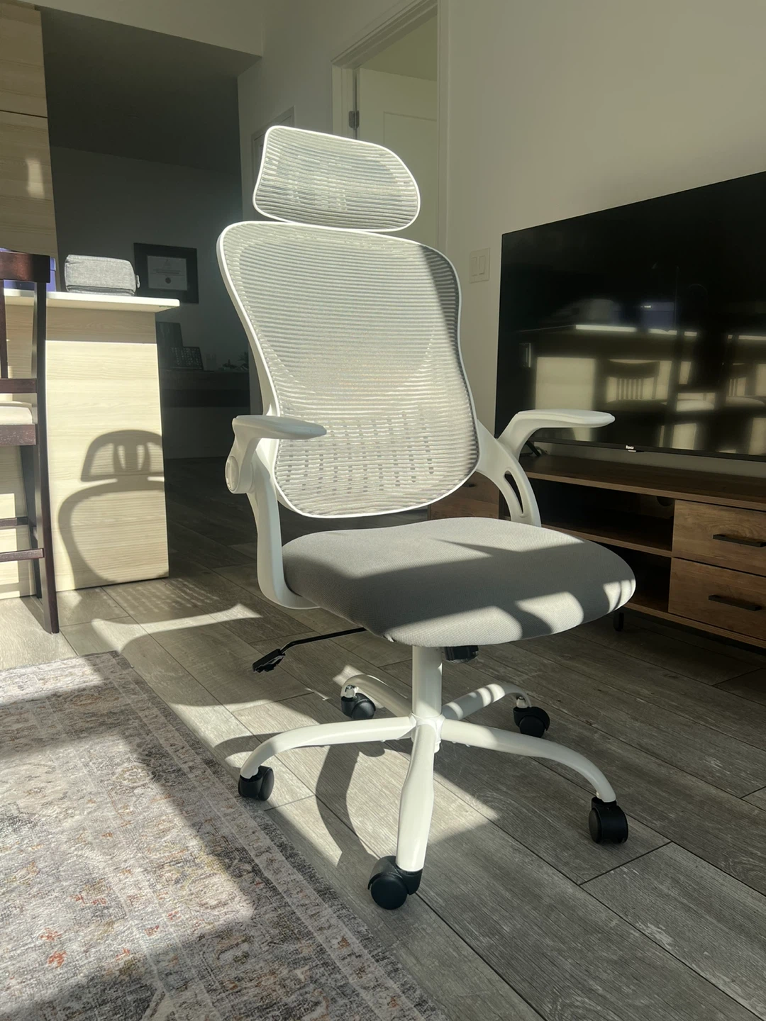 White ergonomic office chair with mesh back