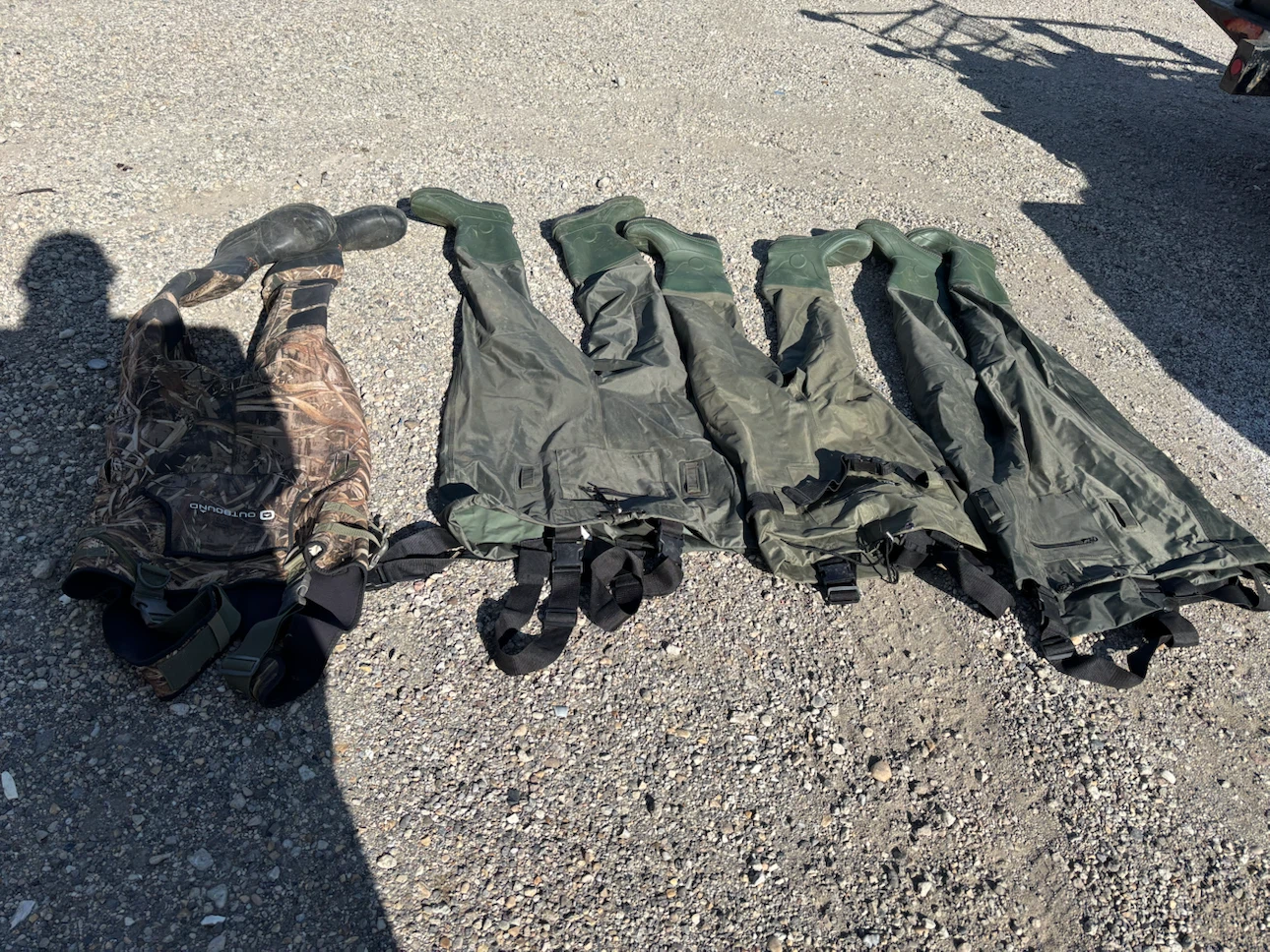 4 pairs of hunting boots and coveralls